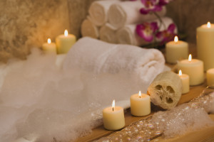 Apartments For Rent in Katy TX, Oak Park Apartments An elegant bath tub adorned with candles and flowers in Oak Park Apartments.