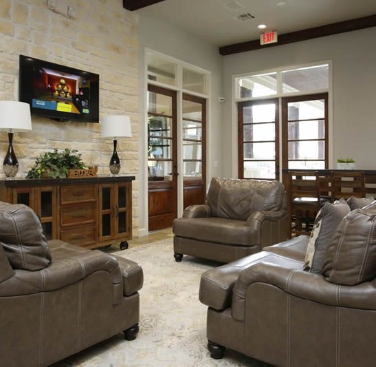 Apartments For Rent in Katy TX, Oak Park Apartments Oak Park Apartments offers stylish living spaces in Katy, TX with modern amenities including a spacious living room furnished with luxurious leather furniture and equipped with a high-definition TV.