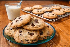 Apartments For Rent in Katy TX, Oak Park Apartments Chocolate chip cookies on a plate with a glass of milk at Oak Park Apartments.