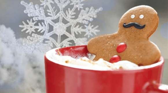 Apartments For Rent in Katy TX, Oak Park Apartments A gingerbread man is sitting in a cup of hot cocoa at Oak Park Apartments.