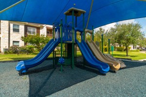 Apartments in Katy, Texas - Childrens Playground with Slides Up Close