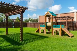 Apartments in Katy, Texas - Dog Park with Equipment and Pergola