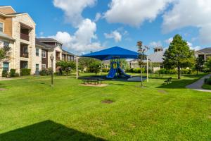 Apartments in Katy, TX - Playground with Lots of Green Space